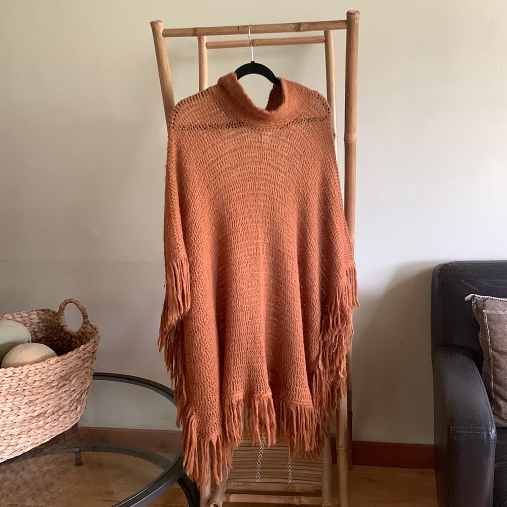 Rust colored open knit poncho